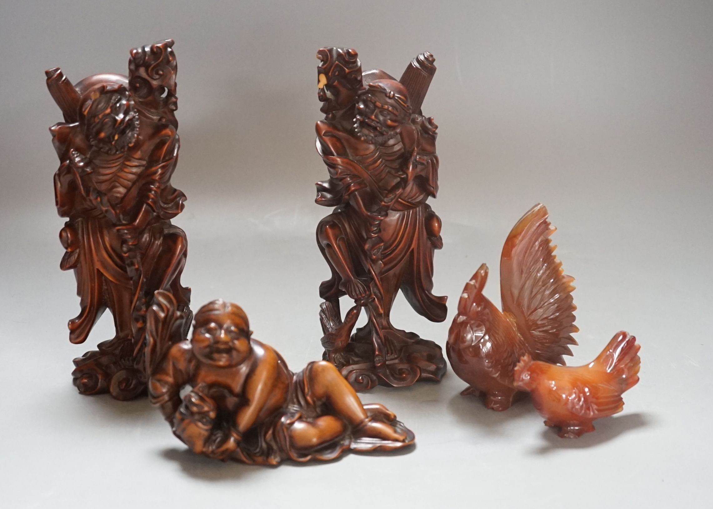 Three Chinese boxwood figures of two luohan, 18cm and Liu Hai and two hardstone chickens